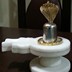 Parad Shivling weighing 1.25 kgs (Dimension : 3 inch height , 6 inch Circumference) seated in a White Marble yoni along with a Golden Panchdhatu Serpant
