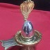 Parad Shivling weighing 350 grams (oval in shape) seated on a Golden brass yoni and revolvable golden brass Serpant